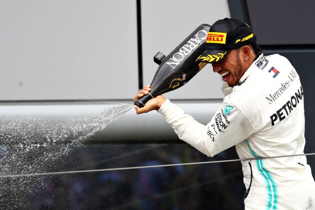 NORTHAMPTON, ENGLAND - JULY 14: Race winner Lewis Hamilton of Great Britain and Mercedes GP celebrates on the podium during the F1 Grand Prix of Great Britain at Silverstone on July 14, 2019 in Northampton, England. (Photo by Mark Thompson/Getty Images)