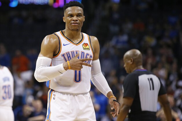 Oklahoma City Thunder guard Russell Westbrook (0) gestures to the crowd in the second half of an NBA basketball game against the Los Angeles Lakers, Tuesday, April 2, 2019, in Oklahoma City. Westbrook became just the second player in NBA history to have 20 points, 20 rebounds and 20 assists in a game as the Oklahoma City Thunder defeated the Los Angeles Lakers 119-103. (AP Photo/Sue Ogrocki)