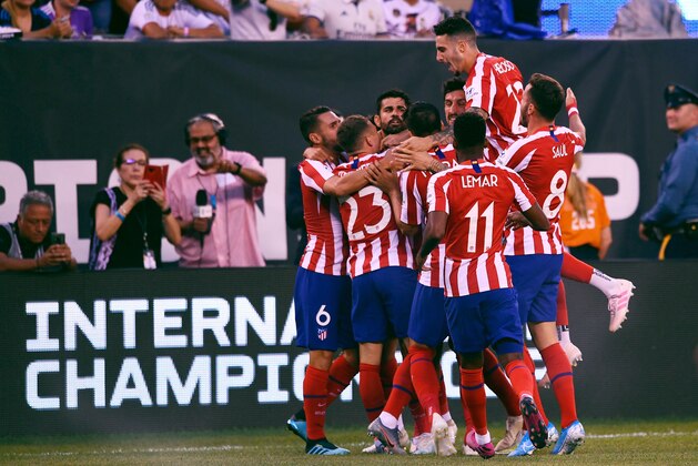 Atletico Madrid's Brazilian foward Diego Costa (C) celebrates with teammates after scoring during their 2019 International Champions Cup football match between Real Madrid and Atletico Madrid at the Metlife Stadium Arena in East Rutherford, New Jersey on July 26, 2019. (Photo by Johannes EISELE / AFP)        (Photo credit should read JOHANNES EISELE/AFP/Getty Images)