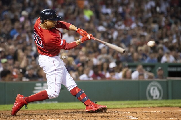 BOSTON, MA - JULY 26: Mookie Betts #50 of the Boston Red Sox hits a double during the sixth inning of a game against the New York Yankees on July 26, 2019 at Fenway Park in Boston, Massachusetts. (Photo by Billie Weiss/Boston Red Sox/Getty Images)