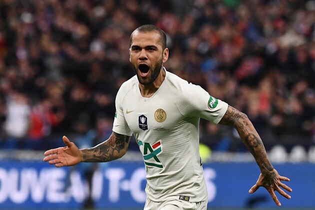 Paris Saint-Germain's Brazilian defender Dani Alves celebrates after scoring a goal during the French Cup final football match between Rennes (SRFC) and Paris Saint-Germain (PSG), on April 27, 2019 at the Stade de France in Saint-Denis, outside Paris. (Photo by Anne-Christine POUJOULAT / AFP)        (Photo credit should read ANNE-CHRISTINE POUJOULAT/AFP/Getty Images)