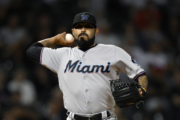 CHICAGO, ILLINOIS - JULY 24: Sergio Romo #54 of the Miami Marlins throws to first base for the out against the Chicago White Sox at Guaranteed Rate Field on July 24, 2019 in Chicago, Illinois. (Photo by Quinn Harris/Getty Images)