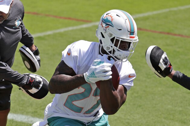 Miami Dolphins running back Kalen Ballage (27) runs drills during voluntary minicamp at the Miami Dolphins football training facility, Tuesday, April 16, 2019, in Davie, Fla. (AP Photo/Lynne Sladky)