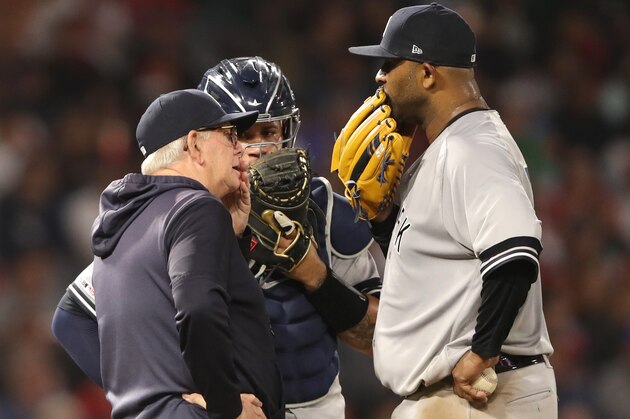ANAHEIM, CALIFORNIA - APRIL 24:  CC Sabathia #52 talks with pitching coach Larry Rothschild #58  and Noe Ramirez #24 the fourth inning  of a game against the Los Angeles Angels of Anaheim  at Angel Stadium of Anaheim on April 23, 2019 in Anaheim, California. (Photo by Sean M. Haffey/Getty Images)