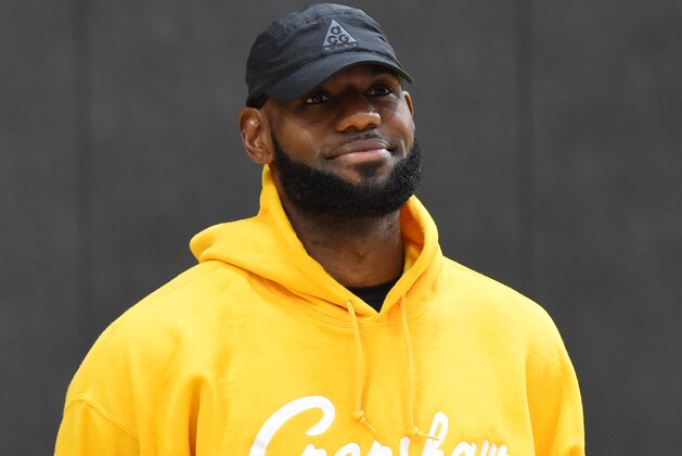 EL SEGUNDO, CA - JULY 13 :  LeBron James #23 of the Los Angeles Lakers looks on as General Manager Rob Pelinka and Head Coach Frank Vogel introduce Anthony Davis #3 of the Los Angeles Lakers during a press conference on July 13, 2019 at the UCLA Health Training Center in El Segundo, California. NOTE TO USER: User expressly acknowledges and agrees that, by downloading and/or using this photograph, user is consenting to the terms and conditions of the Getty Images License Agreement. Mandatory Copyright Notice: Copyright 2019 NBAE (Photo by Juan Ocampo/NBAE via Getty Images)