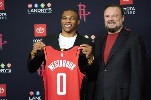 Houston Rockets General Manager Daryl Morey, right, poses with recently acquired guard Russell Westbrook during an NBA basketbll news conference, Friday, July 26, 2019, in Houston. Westbrook was acquired from the Oklahoma City Thunder. (AP Photo/David J. Phillip)