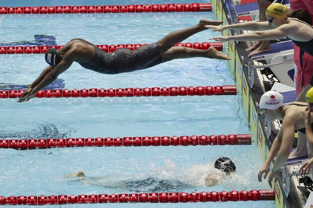 United States' Simone Manuel dives in for the final leg of the women's 4x100m medley relay final at the World Swimming Championships in Gwangju, South Korea, Sunday, July 28, 2019. (AP Photo/Mark Schiefelbein)