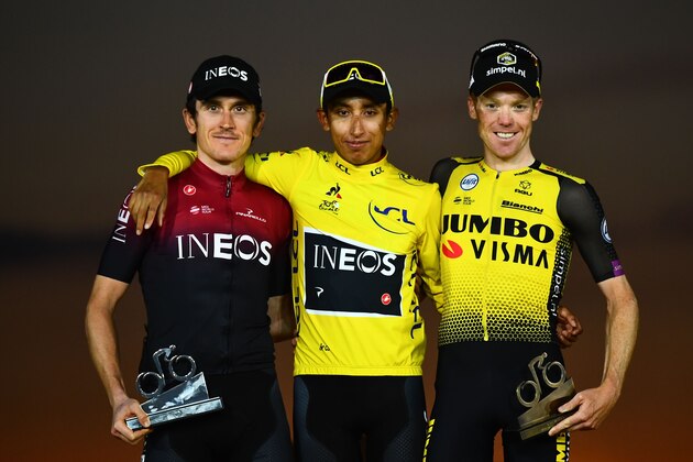 Colombia's Egan Bernal (C) celebrates his overall leader's yellow jersey as he poses with second-placed Great Britain's Geraint Thomas (L) and third-placed Netherlands' Steven Kruijswijk on the podium of the 21st and last stage of the 106th edition of the Tour de France cycling race between Rambouillet and Paris Champs-Elysees, in Paris on July 28, 2019. (Photo by Marco Bertorello / AFP)        (Photo credit should read MARCO BERTORELLO/AFP/Getty Images)
