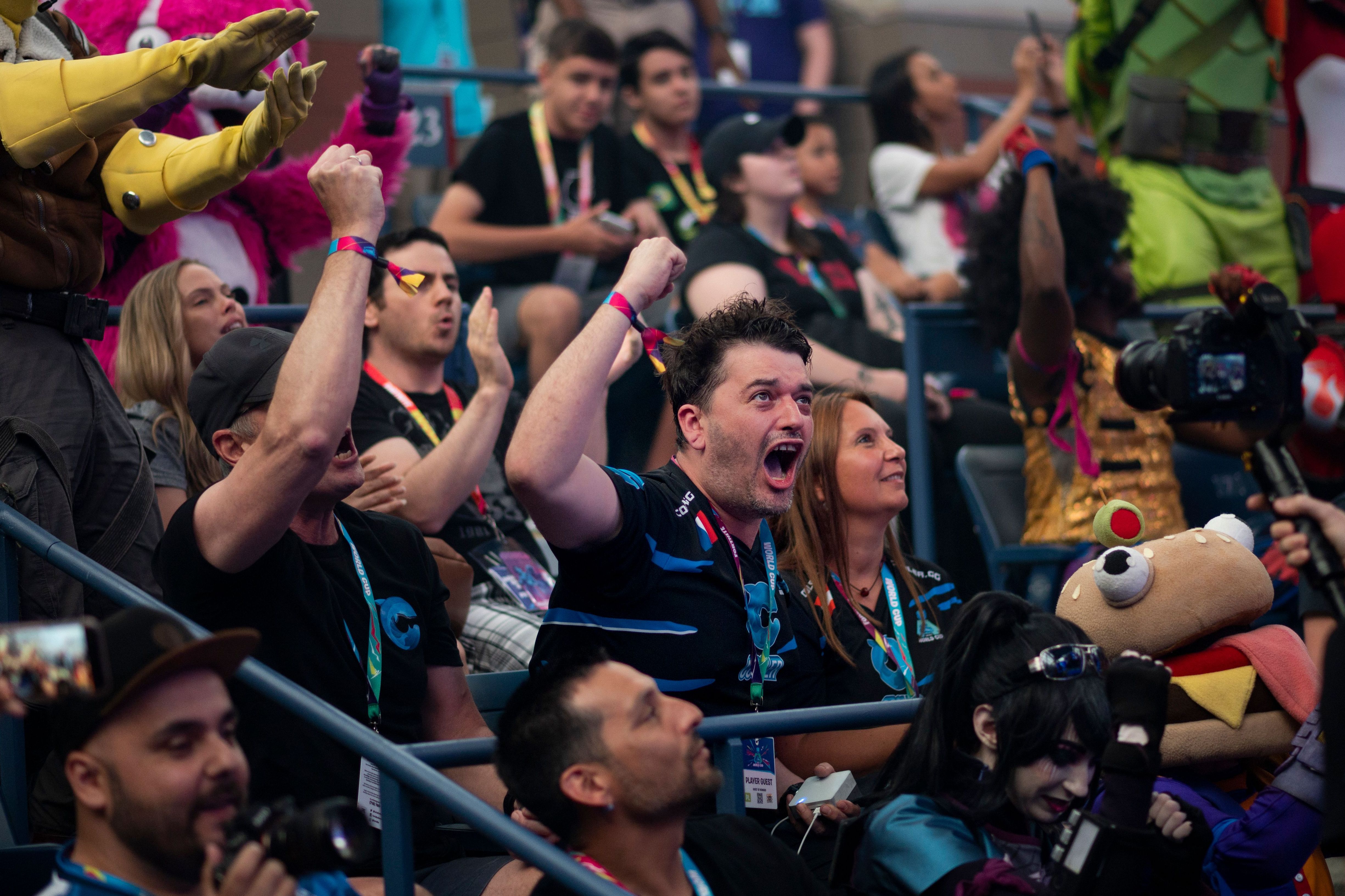 A fan reacts during the final seconds of the Duos competition at the 2019 Fortnite World Cup July 27, 2019 inside of Arthur Ashe Stadium, in New York City. (Photo by Johannes EISELE / AFP)        (Photo credit should read JOHANNES EISELE/AFP/Getty Images)