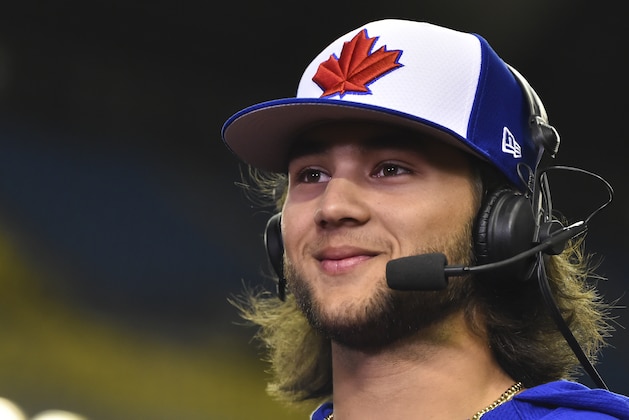 MONTREAL, QC - MARCH 26:  Bo Bichette #66 of the Toronto Blue Jays is interviewed prior to MLB spring training game against the Milwaukee Brewers at Olympic Stadium on March 26, 2019 in Montreal, Quebec, Canada.  The Toronto Blue Jays defeated the Milwaukee Brewers 2-0.  (Photo by Minas Panagiotakis/Getty Images)
