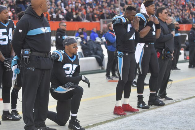 Carolina Panthers strong safety Eric Reid kneels during the national anthem before an NFL football game against the Cleveland Browns, Sunday, Dec. 9, 2018, in Cleveland. Cleveland won 26-20. (AP Photo/David Richard)