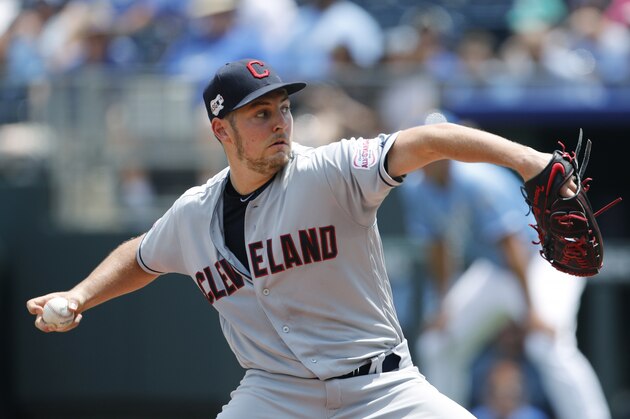 Cleveland Indians pitcher Trevor Bauer throws against the Kansas City Royals in the first inning of a baseball game at Kauffman Stadium in Kansas City, Mo., Sunday, July 28, 2019. (AP Photo/Colin E. Braley)