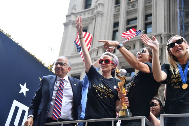 President of the USA Soccer Federation Carlos Cordeiro, Megan Rapinoe, Alex Morgan,Allie Long and other members of the World Cup-winning US women's team take part in a ticker tape parade for the women's World Cup champions on July 10, 2019 in New York. - Tens of thousands of fans are poised to pack the streets of New York on Wednesday to salute the World Cup-winning US women's team in a ticker-tape parade. Four years after roaring fans lined the route of Lower Manhattan's fabled