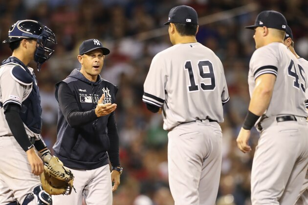 BOSTON, MA - JULY 25:  Masahiro Tanaka #19 of the New York Yankees is pulled by Manager Aaron Boone in the fourth inning of a game against the Boston Red Sox at Fenway Park on July 25, 2019 in Boston, Massachusetts.  (Photo by Adam Glanzman/Getty Images)