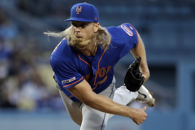 New York Mets starting pitcher Noah Syndergaard watches a throw to a Los Angeles Dodgers batter during the second inning of a baseball game Wednesday, May 29, 2019, in Los Angeles. (AP Photo/Marcio Jose Sanchez)