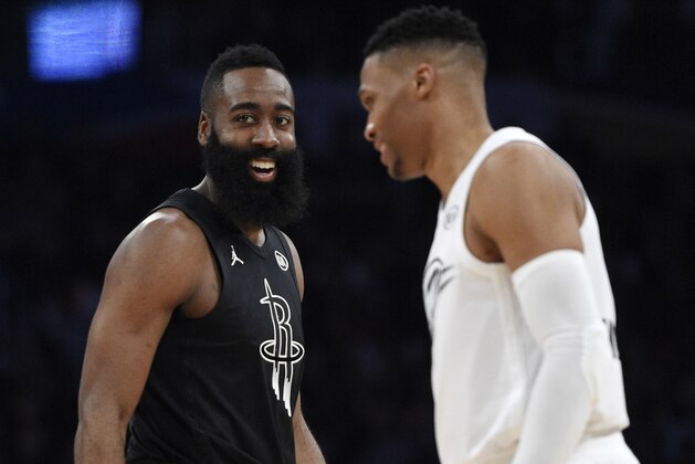 Team Stephen's James Harden, left, of the Houston Rockets, talks with Team LeBron's Russell Westbrook, of the Oklahoma City Thunder, during the second half of an NBA All-Star basketball game, Sunday, Feb. 18, 2018, in Los Angeles. (AP Photo/Chris Pizzello)
