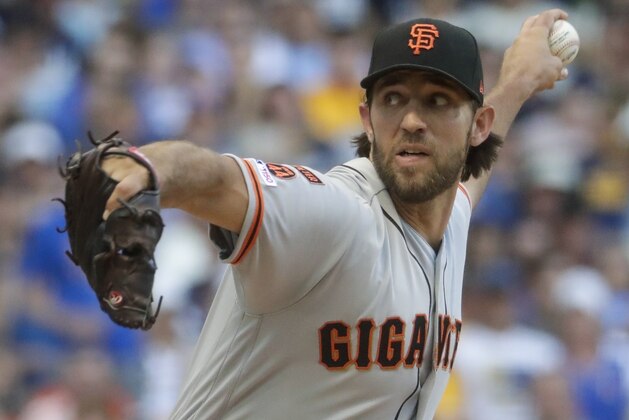San Francisco Giants starting pitcher Madison Bumgarner throws during the first inning of a baseball game against the Milwaukee Brewers Saturday, July 13, 2019, in Milwaukee. (AP Photo/Morry Gash)