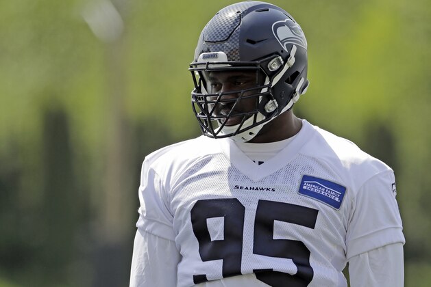 Seattle Seahawks defensive end L.J. Collier stands on the field during the first day of NFL football rookie mini camp, Friday, May 3, 2019, in Renton, Wash. (AP Photo/Ted S. Warren)