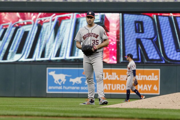 Houston Astros pitcher Justin Verlander  (35) reacts after giving up a solo home run to Minnesota Twins' Ehire Adrianza in the third inning of a baseball game Monday, April 29, 2019, in Minneapolis. (AP Photo/Jim Mone)