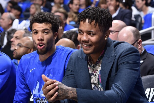 ORLANDO, FL - APRIL 21: Michael Carter-Williams #7 of the Orlando Magic smiles with Markelle Fultz #20 of the Orlando Magic on the bench during the game against the Toronto Raptors during Game Four of Round One of the 2019 NBA Playoffs on April 21, 2019 at Amway Center in Orlando, Florida. NOTE TO USER: User expressly acknowledges and agrees that, by downloading and or using this photograph, User is consenting to the terms and conditions of the Getty Images License Agreement. Mandatory Copyright Notice: Copyright 2019 NBAE (Photo by Fernando Medina/NBAE via Getty Images)