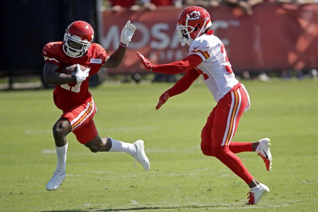 Kansas City Chiefs wide receiver Mecole Hardman, left, tries to evade Kansas City Chiefs defensive back Herb Miller during NFL football training camp Monday, July 29, 2019, in St. Joseph, Mo. (AP Photo/Charlie Riedel)