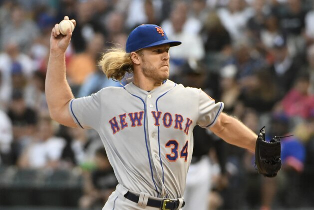 New York Mets starting pitcher Noah Syndergaard throws to a Chicago White Sox batter during the first inning of a baseball game Tuesday, July 30, 2019, in Chicago. (AP Photo/David Banks)