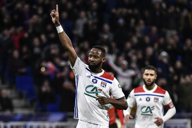 Lyon's French forward Moussa Dembele (L) celebrates after scoring a penalty during the French Cup semi final football match between Lyon and Rennes at the Parc Olympique Lyonnais stadium in Decines-Charpieu, on April 2, 2019. (Photo by JEFF PACHOUD / AFP)        (Photo credit should read JEFF PACHOUD/AFP/Getty Images)