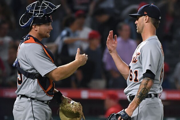 ANAHEIM, CALIFORNIA - JULY 29:  John Hicks #55 and Shane Greene #61 of the Detroit Tigers celebrate a 7-2 win over the Los Angeles Angels at Angel Stadium of Anaheim on July 29, 2019 in Anaheim, California. (Photo by Harry How/Getty Images)