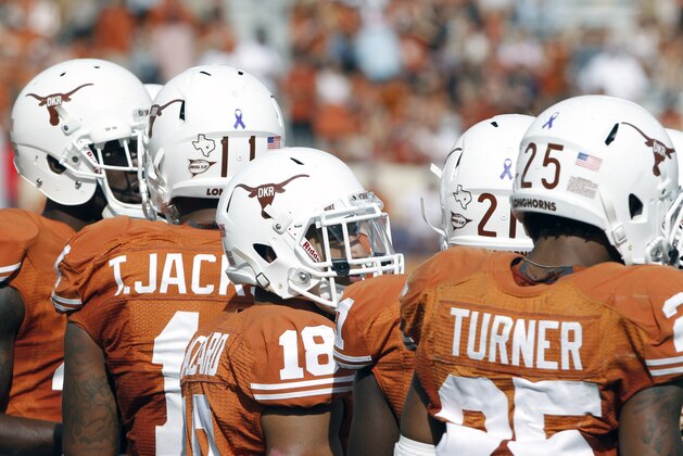 Texas players wear a Texas Longhorn helmet logo with the initials of former head coach Darrell K Royal in an NCAA college football game against Iowa State at Darrell K Royal-Memorial Stadium, Saturday, Nov. 10, 2012, in Austin, Texas. Texas won 33-7. (AP Photo/Michael Thomas)