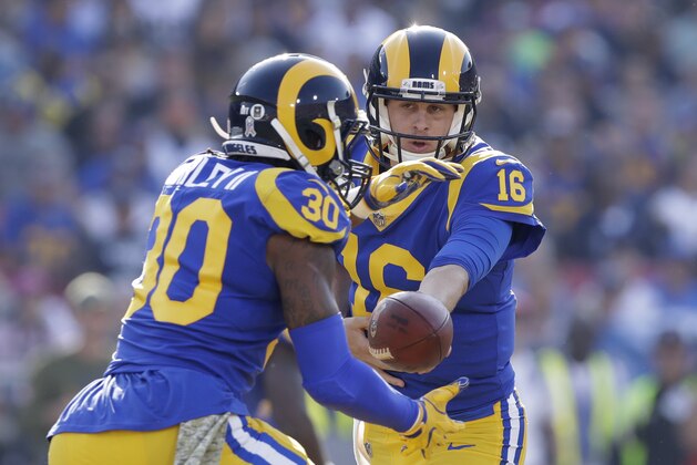 Los Angeles Rams quarterback Jared Goff (16) hands off to running back Todd Gurley (30) during the first half in an NFL football game against the Seattle Seahawks Sunday, Nov. 11, 2018, in Los Angeles. (AP Photo/Alex Gallardo)