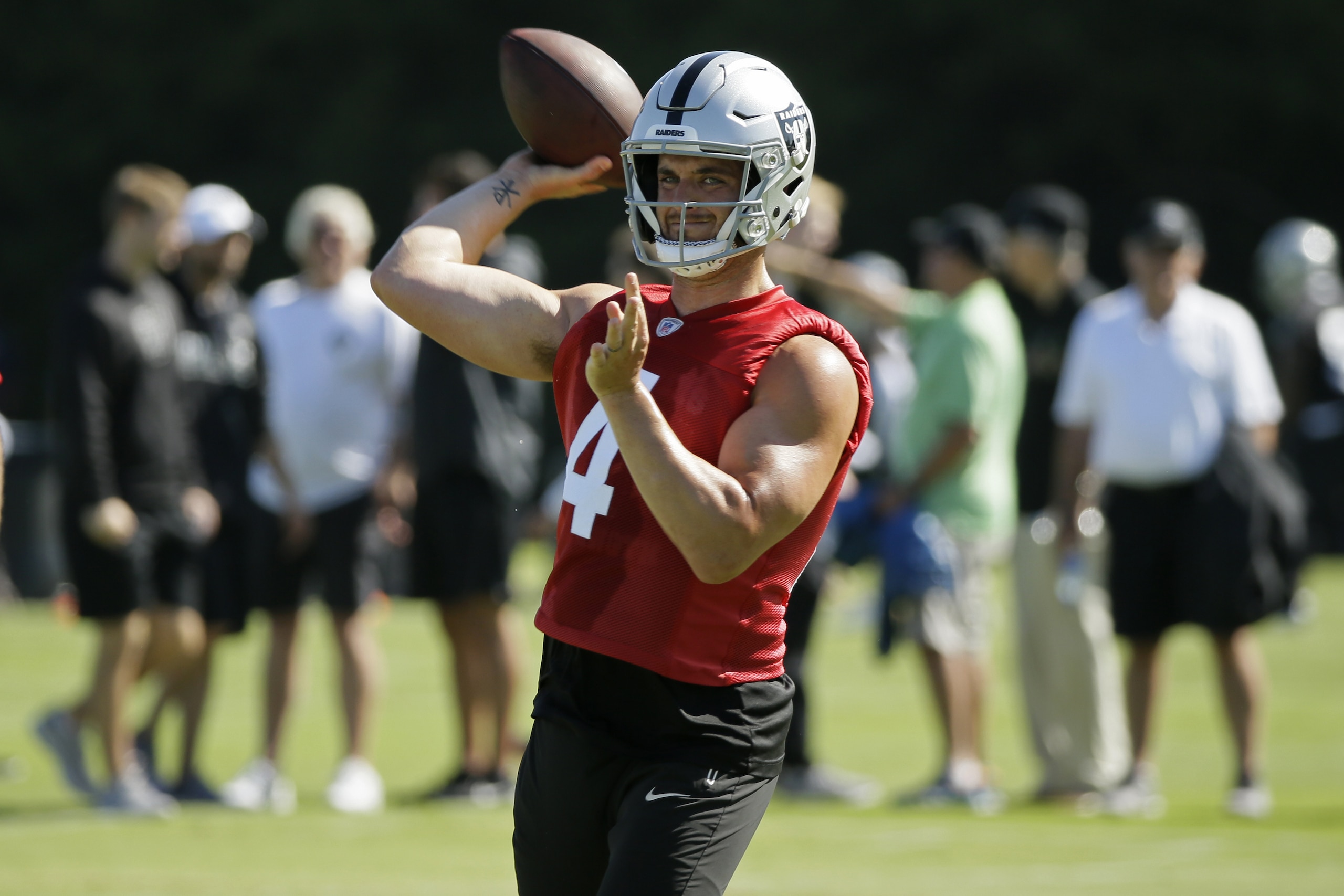Oakland Raiders quarterback Derek Carr throws during NFL football training camp Saturday, July 27, 2019, in Napa, Calif. (AP Photo/Eric Risberg)