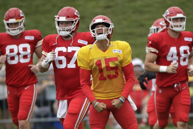 Kansas City Chiefs quarterback Patrick Mahomes (15) leads teammates onto the field for a drill during NFL football training camp Monday, July 29, 2019, in St. Joseph, Mo. (AP Photo/Charlie Riedel)