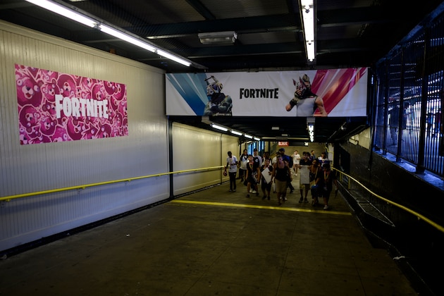 A subway station with Fortnite characters banner is seen after after the Solo competition at the 2019 Fortnite World Cup July 28, 2019 near Arthur Ashe Stadium, in New York City. (Photo by Johannes EISELE / AFP)        (Photo credit should read JOHANNES EISELE/AFP/Getty Images)