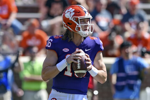 Clemson's Trevor Lawrence drops back to pass during Clemson's annual Orange and White NCAA college football spring scrimmage Saturday, April 6, 2019, in Clemson, S.C. (AP Photo/Richard Shiro)