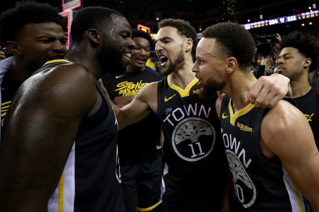 OAKLAND, CALIFORNIA - MAY 16: Stephen Curry #30, Klay Thompson #11 and Draymond Green #23 of the Golden State Warriors celebrate after defeating the Portland Trail Blazers 114-111 in game two of the NBA Western Conference Finals at ORACLE Arena on May 16, 2019 in Oakland, California. NOTE TO USER: User expressly acknowledges and agrees that, by downloading and or using this photograph, User is consenting to the terms and conditions of the Getty Images License Agreement. (Photo by Ezra Shaw/Getty Images)