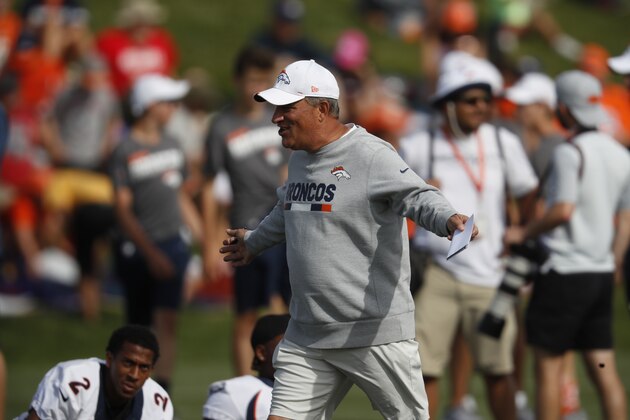 Denver Broncos head coach Vic Fangio warms up during an NFL training camp practice at the team's headquarters Tuesday, July 30, 2019, in Englewood, Colo. (AP Photo/David Zalubowski)