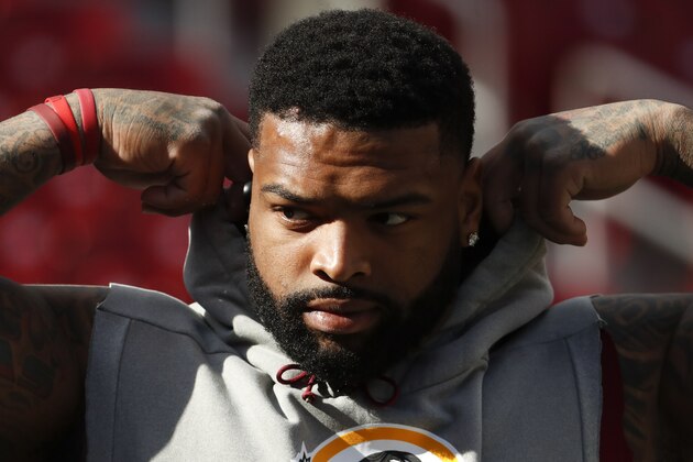 Washington Redskins offensive tackle Trent Williams (71) takes the field for warms up before an NFL football game against the Dallas Cowboys Sunday, Oct. 21, 2018, in Landover, Md. (AP Photo/Andrew Harnik)