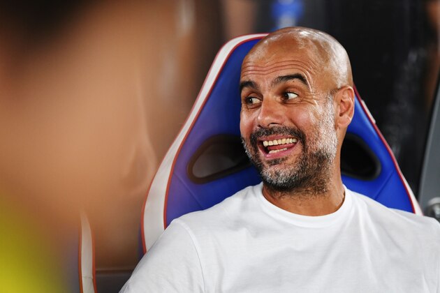 Manchester City's head coach Pep Guardiola is pictured before a friendly football match between English Premier League club Manchester City and Japan League Yokohama F. Marinos at the Yokohama Stadium, in Yokohama on July 27, 2019. (Photo by CHARLY TRIBALLEAU / AFP)        (Photo credit should read CHARLY TRIBALLEAU/AFP/Getty Images)