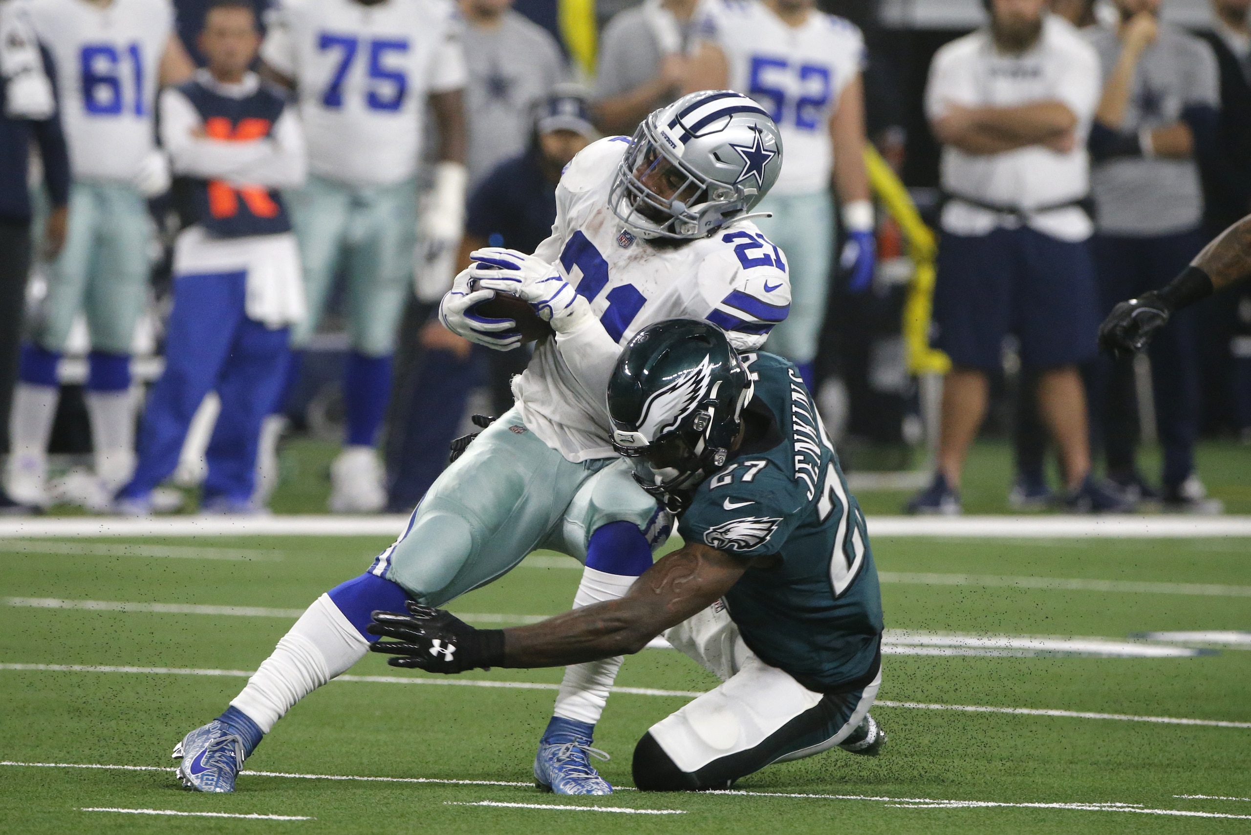 Dallas Cowboys running back Ezekiel Elliott (21) is stopped by Philadelphia Eagles' Malcolm Jenkins (27) during the first half of an NFL football game, in Arlington, Texas, Sunday, Dec. 9, 2018. (AP Photo/Michael Ainsworth) Dallas Cowboys running back Ezekiel Elliott (21) is stopped by Philadelphia Eagles' Malcolm Jenkins (27) during the first half of an NFL football game, in Arlington, Texas, Sunday, Dec. 9, 2018. (AP Photo/Michael Ainsworth)