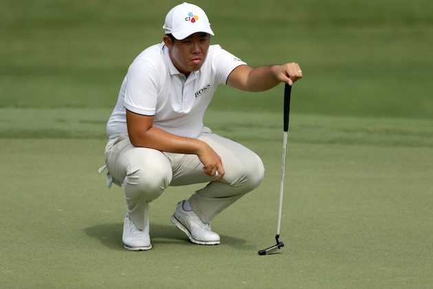 GREENSBORO, NORTH CAROLINA - AUGUST 02: Byeong Hun An of South Korea lines up a putt on the 17th hole during the second round of the Wyndham Championship at Sedgefield Country Club on August 02, 2019 in Greensboro, North Carolina. (Photo by Tyler Lecka/Getty Images)