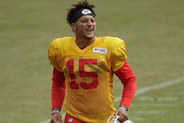 Kansas City Chiefs quarterback Patrick Mahomes (15) walks between drills during NFL football training camp Friday, Aug. 2, 2019, in St. Joseph, Mo. (AP Photo/Charlie Riedel)