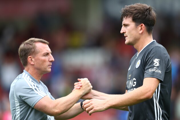 SCUNTHORPE, ENGLAND - JULY 20: Harry Maguire (r) of Leicester City shakes hands with manager Brendan Rodgers during the Pre-Season Friendly match between Cheltenham Town and Leicester City at the Jonny-Rocks Stadium on July 20, 2019 in Cheltenham, England. (Photo by Michael Steele/Getty Images)