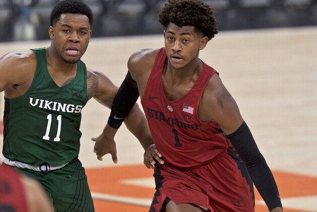 Stanford guard Daejon Davis, right, dribbles past Portland State guard Deante Strickland during the first half of an NCAA college basketball game in the Phil Knight Invitational tournament in Portland, Ore., Sunday, Nov. 26, 2017. (AP Photo/Craig Mitchelldyer)