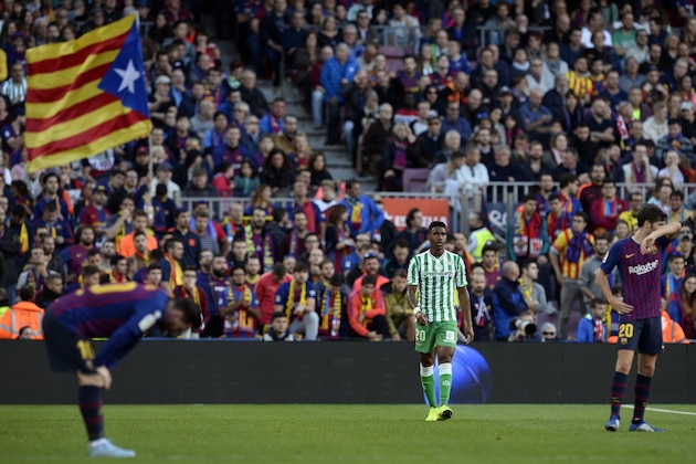 Real Betis' Dominican defender Junior Firpo (C) walks on the pitch after scoring the opening goal during the Spanish league football match between FC Barcelona and Real Betis at the Camp Nou stadium in Barcelona on November 11, 2018. (Photo by Josep LAGO / AFP)        (Photo credit should read JOSEP LAGO/AFP/Getty Images)