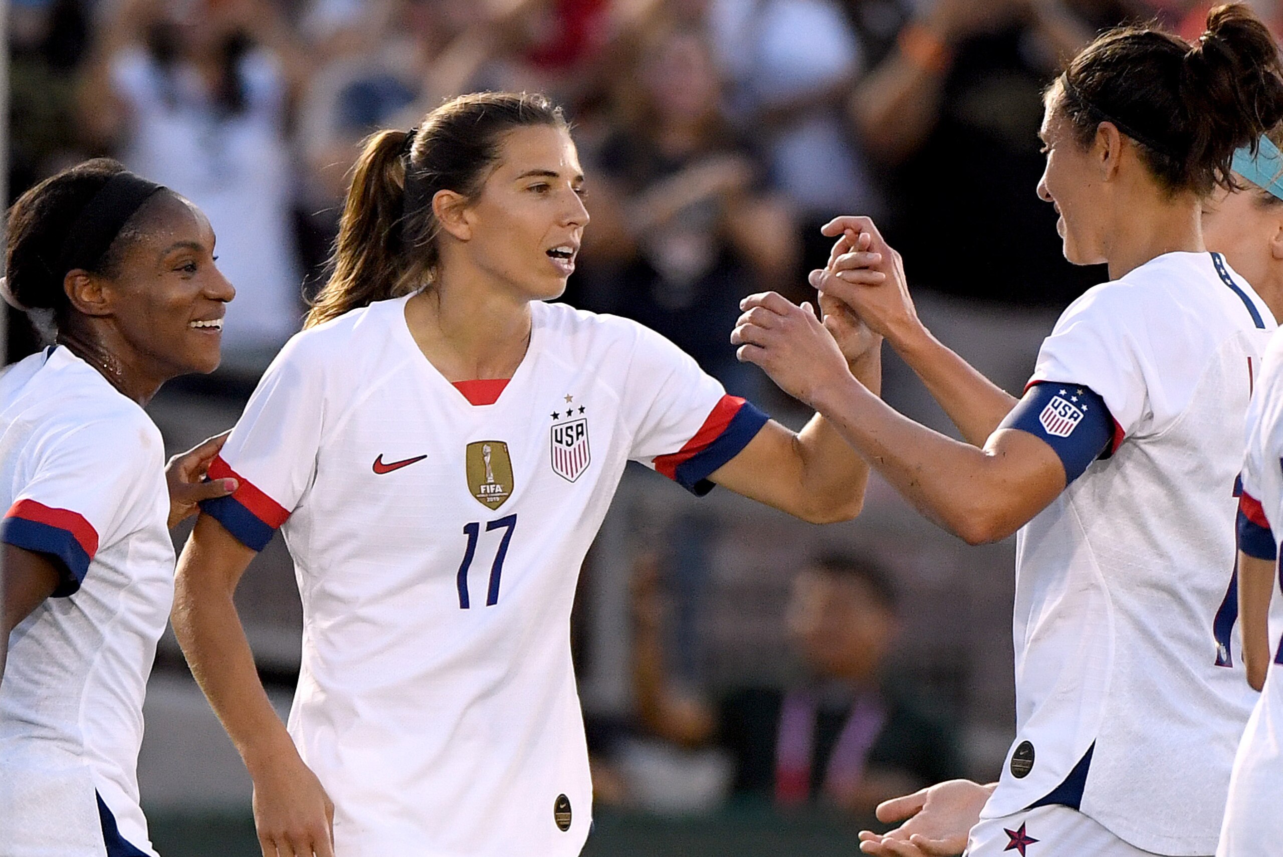 PASADENA, CALIFORNIA - AUGUST 03:  Tobin Heath #17 of the United States celebrates her goal with Crystal Dunn #19 and Carli Lloyd #10, to take a 1-0 lead over The Republic of Ireland during the first half of the first game of the USWNT Victory Tour at Rose Bowl on August 03, 2019 in Pasadena, California. (Photo by Harry How/Getty Images)