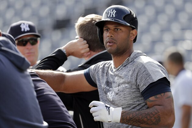 New York Yankees' Aaron Hicks takes batting practice before a spring training baseball game against the Toronto Blue Jays, Monday, Feb. 25, 2019, in Tampa, Fla. The Yankees announced that Hicks signed a seven-year contract Monday. (AP Photo/Lynne Sladky)