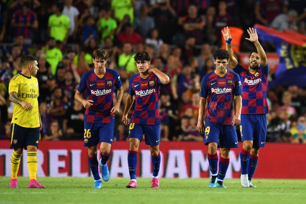 BARCELONA, SPAIN - AUGUST 04:  Luis Suarez of Barcelona (R) celebrates after scoring his team's second goal with team mates during the Joan Gamper Trophy pre-season friendly match between FC Barcelona and Arsenal at Nou Camp on August 04, 2019 in Barcelona, Spain. (Photo by David Ramos/Getty Images)