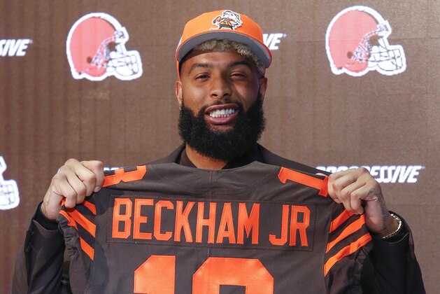 Cleveland Browns' Odell Beckham poses with his jersey during a news conference Monday, April 1, 2019, in Berea, Ohio. (AP Photo/Ron Schwane)