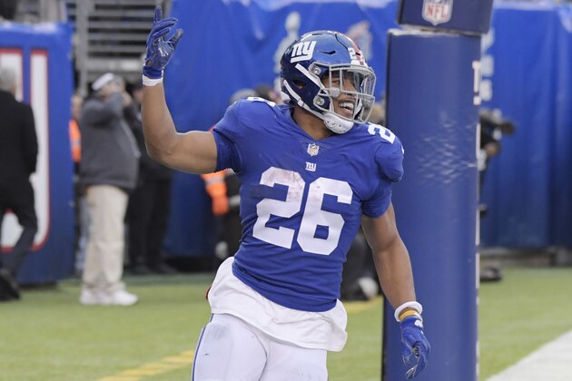 New York Giants' Saquon Barkley reacts after scoring a touchdown during the second half of an NFL football game against the Dallas Cowboys, Sunday, Dec. 30, 2018, in East Rutherford, N.J. (AP Photo/Bill Kostroun)