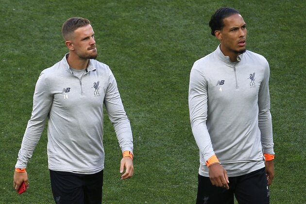 Liverpool's Virgil van Dijk, right, and Liverpool's Jordan Henderson before a training session at the Olimpiyskiy Stadium in Kiev, Ukraine, Friday, May 25, 2018 ahead of the Champions League final soccer match between Real Madrid and Liverpool on Saturday May 26. (AP Photo/Matthias Schrader)